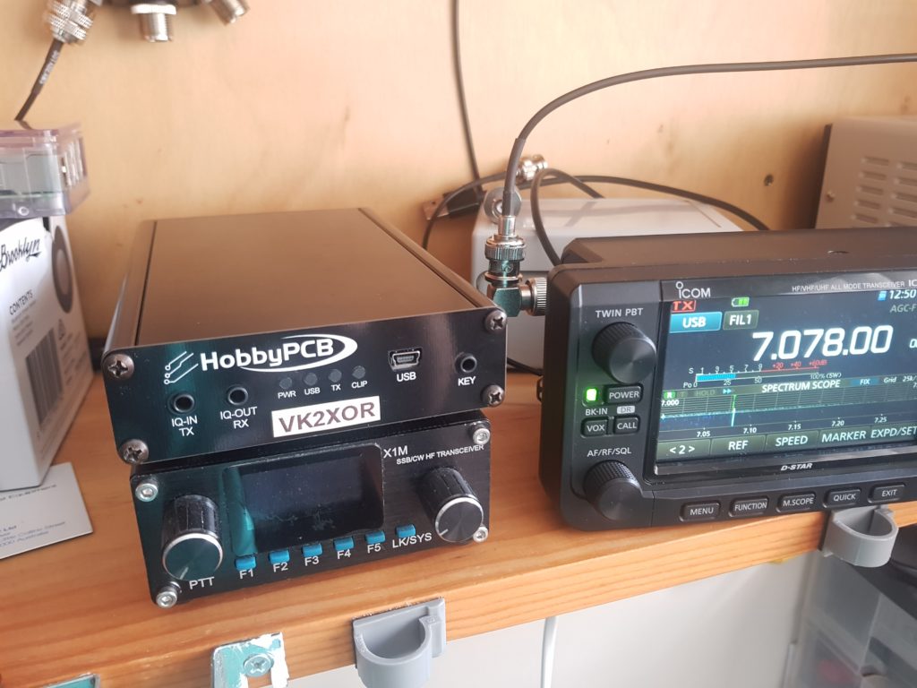 Photo showing RS-HFIQ and X1M Pro next to IC-705